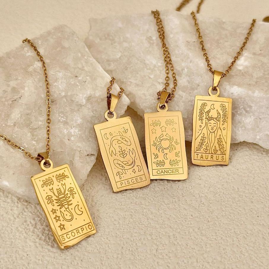https://lilaryenne.com/cdn/shop/files/minimalistzodiacnecklace.jpg?v=1732450334
